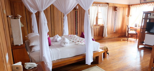 3394d-Myanmar-Treasure-Resort-Bedroom-Inle-Lake.jpg